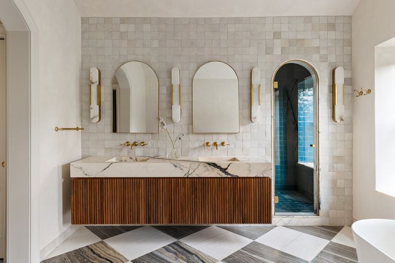 Primary bath double vanity in stone and wood at 59 Lefferts Place, Clinton Hill — photo 10 of 10