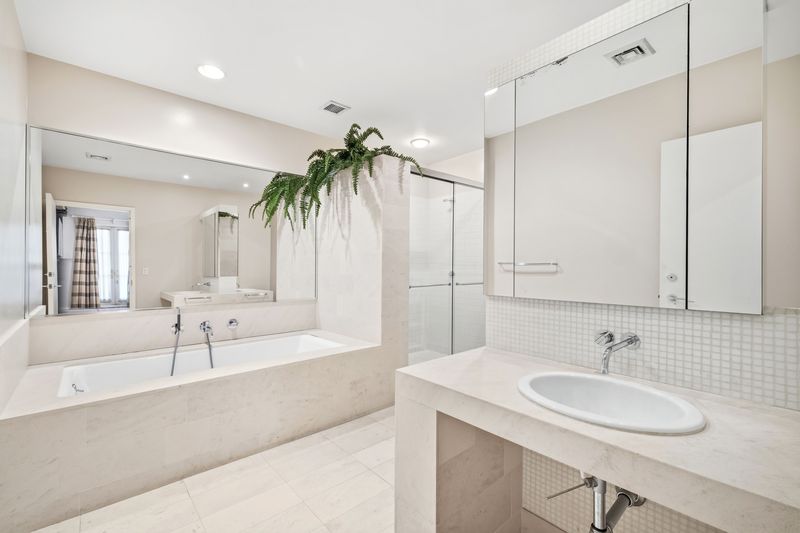 Primary bath with marble soaking tub at 61 North Moore Street 3W, Tribeca — photo 4 of 5