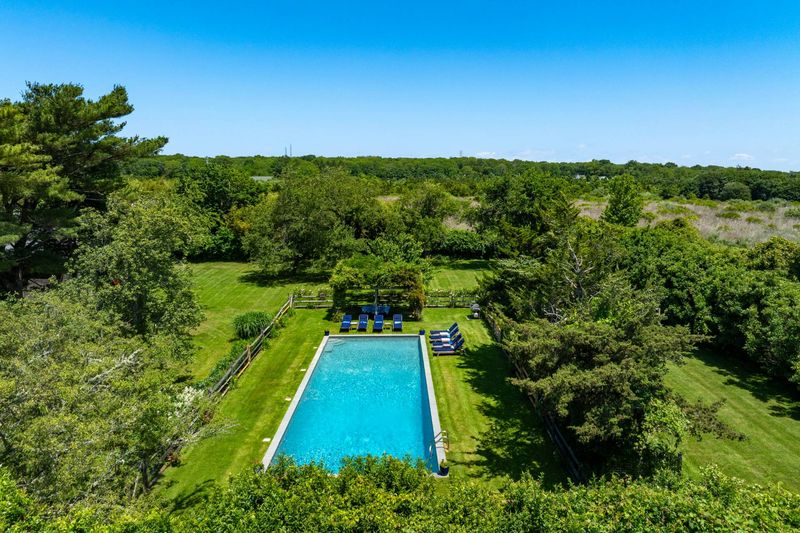 Aerial of the long pool set into the gardens at 645 North Sea Mecox Road, Southampton — photo 3 of 12