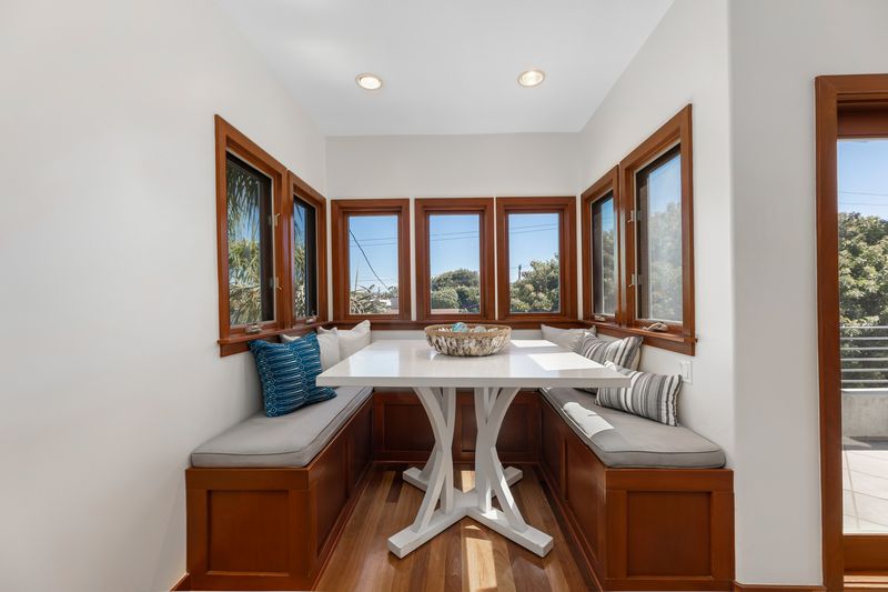 Breakfast nook wrapped in windows at 721 12th Street, Manhattan Beach — photo 7 of 8