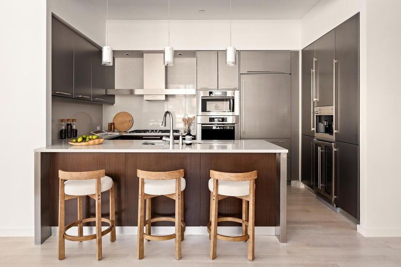 Kitchen island and full-height cabinetry at 76 Madison Avenue PH1, NoMad — photo 5 of 8