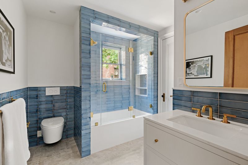 Blue-tiled en-suite bath at 8 Polhemus Place, Park Slope — photo 11 of 12
