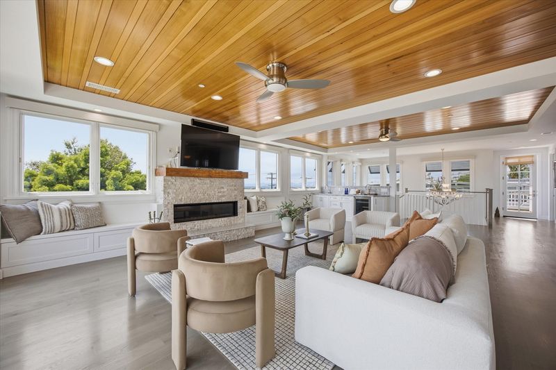 Living room with wood-paneled ceiling at 826 18th Street, Hermosa Beach — photo 7 of 8