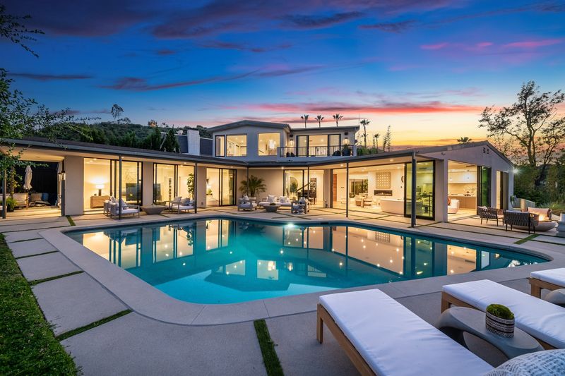Pool and glass pavilion at dusk at 8545 Charl Lane, Hollywood Hills