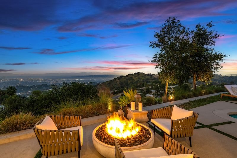 Fire-pit terrace over the city lights at 8545 Charl Lane, Hollywood Hills — photo 3 of 8
