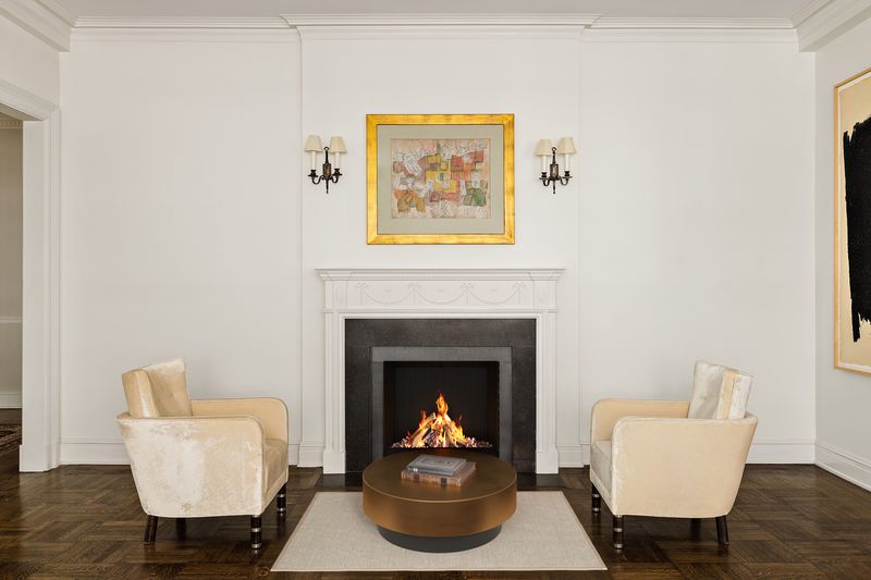 Living room fireplace at 876 Park Avenue 9N, Upper East Side — photo 7 of 12