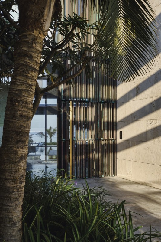 bronze vertical screen at entry
